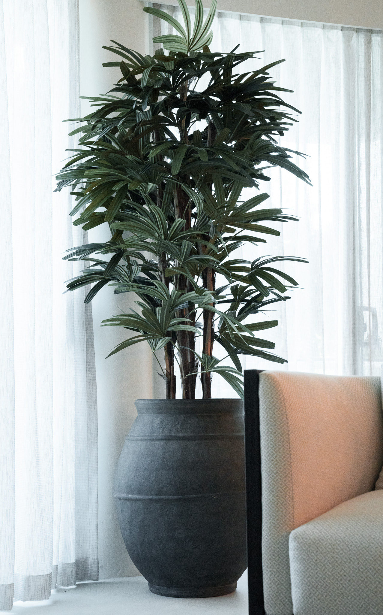 Fake Rhaphis palm in a pot to complete this Resort style Villa