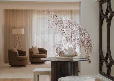 Wide view from the entryway looking into a modern lounge room with light-filled interiors
