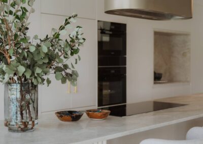 Close-up of a kitchen island featuring Taj Mahal stone with elegant veining