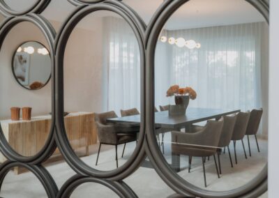 Retro-inspired timber feature framing a glass window in a modern interior