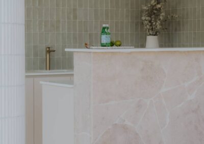 Close-up of a BBQ zone behind the alfresco bar with retro tiles and patterned paving stones