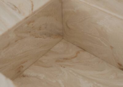 Custom Corian integrated vanity top in a modern bathroom setting