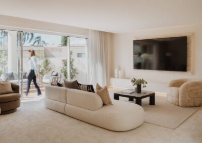 Sliding glass doors opening from the lounge room to the yard for seamless indoor-outdoor living